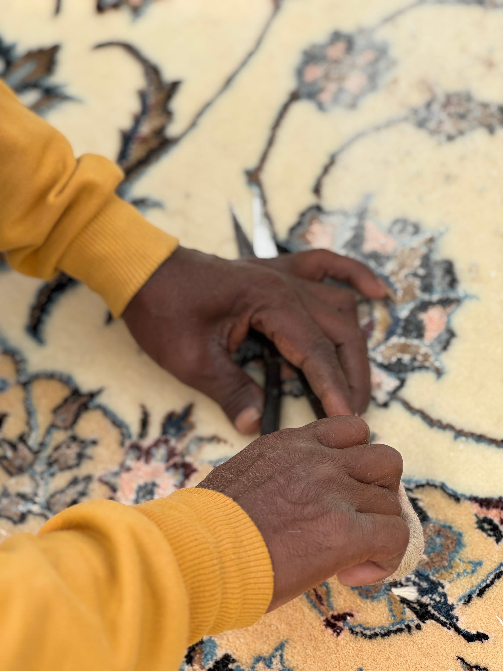 Hand-trimming the pile on a finished rug