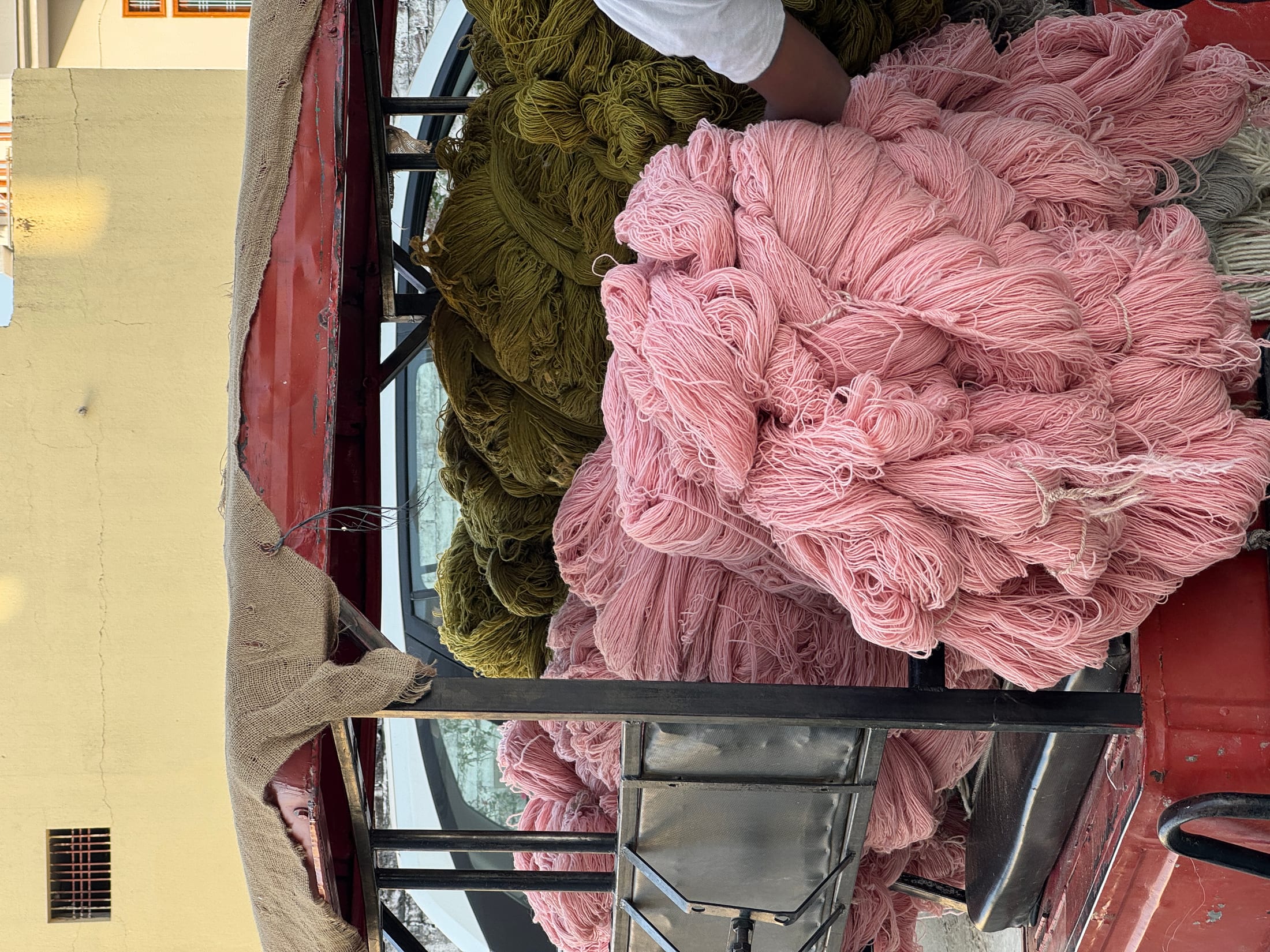 Freshly dyed wool bundles ready for the loom